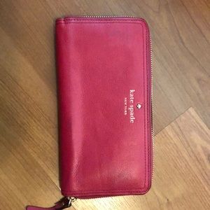 Kate spade pink wallet - has a small Knick on the back of the wallet